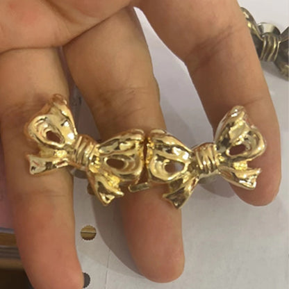 Bow waist adjuster buckle
